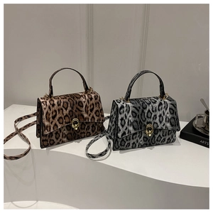 Leopard print crossbody bags with gold hardware and trapezoid flap design for women