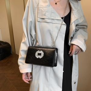 Elegant black glossy small square handbag with crystal buckle and silver chain strap
