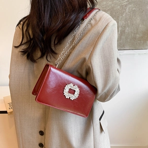 Red crossbody chain bag with rhinestone buckle in polished oil wax leather for women