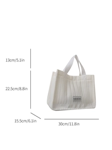 White quilted tote bag with fashion tag and dimensions 30x15.5x22.5cm displayed
