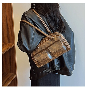 Side view of retro brown PU leather crossbody bag with multiple front pockets and matte texture