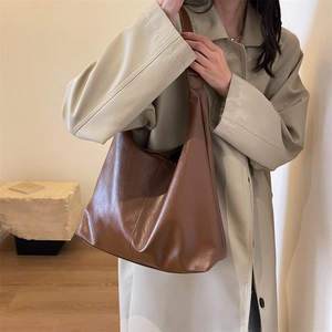Brown faux leather tote bag with large capacity and shoulder strap for women