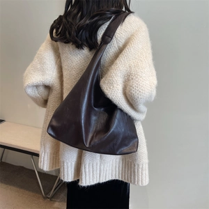 Glossy chocolate brown hobo bag with large capacity and minimalist wide shoulder strap