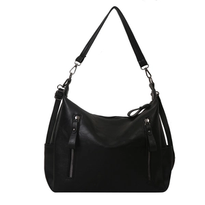 Minimalist black PU leather tote bag with decorative zippers and adjustable strap