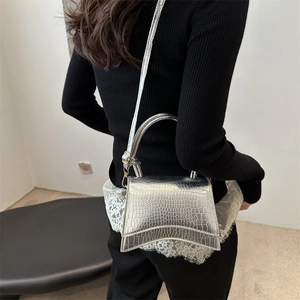 Silver crocodile embossed handbag with metallic finish and detachable chain strap