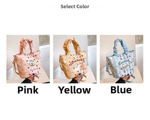 Three colorful canvas bucket bags with cartoon prints and ruffled handles for women