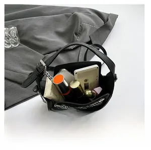 Top view of rhinestone handbag interior showing space for phone, lipstick, and perfume