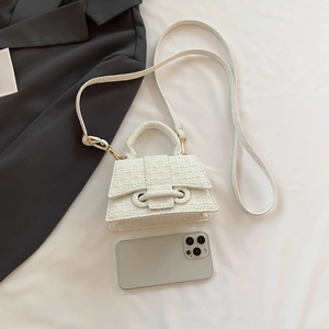 Mini white woven hourglass bag shown with a mobile phone for precise size reference