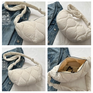 Quilted cloud shoulder bag detail with spacious interior for phone and wallet storage