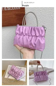 Detail of purple ruched cloud bag with sparkling rhinestone handle and silver chain strap