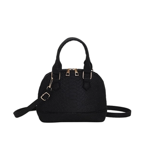 Fashionable black snake texture dome shell handbag with golden hardware and shoulder strap