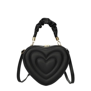 Chic black heart-shaped crossbody bag with quilted layers and ruched handle detail
