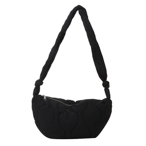 Minimalist black quilted hobo shoulder bag with soft padded straps and wave stitching