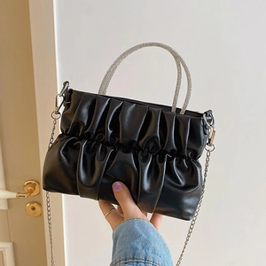 Black ruched cloud handbag with sparkling rhinestone handle and silver chain strap