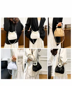 Detailed views of cloud bucket bag featuring large pearl handles in four matte colors