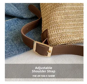 Detail of adjustable dark brown PU strap with gold buckle on straw woven shoulder bag