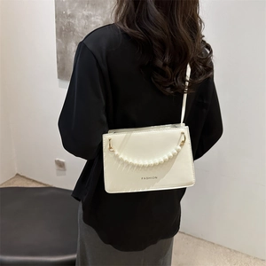 Minimalist white PU leather shoulder bag with pearl chain and fashion logo print