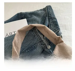 Close-up of comfortable corduroy wide handle and striped texture on the casual pillow bag