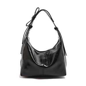 Chic black glossy hobo bag with adjustable strap and polished finish in front view