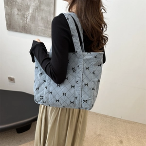 Blue corduroy tote bag with black bow and diamond stitching for women casual autumn style