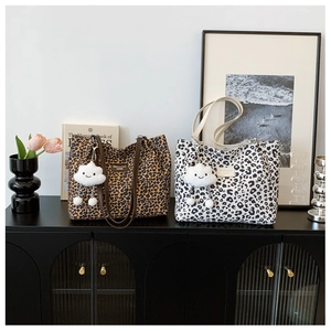 Leopard print canvas tote bags in brown and white with cute plush cloud charms