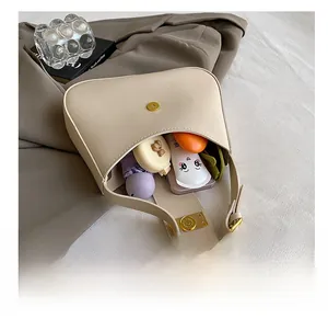 Top view of beige half-moon bag interior showing spacious storage for daily items