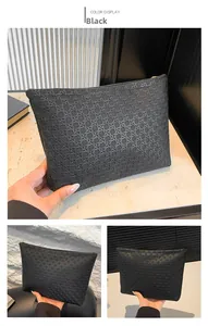 Detail of black woven texture on minimalist large capacity envelope clutch with gold zipper