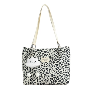 Chic black and white leopard print tote bag with leather straps and cloud charm