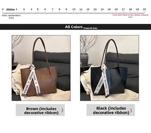Detailansicht großer Vintage-Tragetaschen in Braun und Schwarz mit Seidenbandakzent