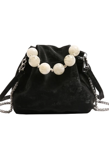 Black velvet bucket bag with white marble resin bead handle and silver chain strap
