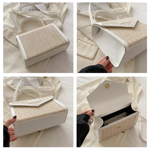 Detail of straw woven crossbody bag with white leather flap and magnetic gold closure