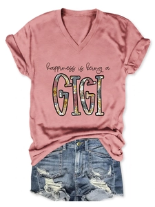 Flat lay of pink V-neck T-shirt with GIGI print and distressed denim shorts set