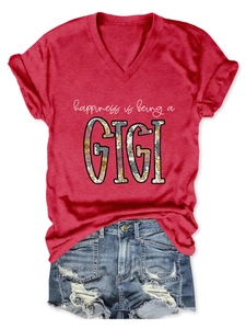 Detail of red V-neck T-shirt featuring happiness is being a GIGI floral lettering