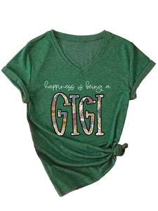 Detail of dark green V-neck T-shirt with GIGI floral print and stylish knot hem