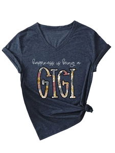 Detail of grey V-neck tee with GIGI floral print and decorative side knot at the hem