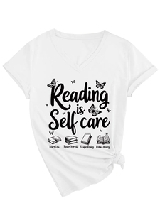 Detail of white V-neck T-shirt with Reading is Self Care print and side knot detail