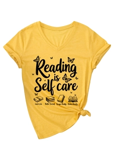 Detail of V-neck mustard t-shirt featuring Reading is Self Care print and knotted hem
