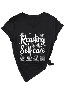 Detail of V-neck T-shirt showing Reading is Self Care text and book illustrations