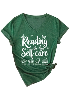 Detail of V-neck cotton T-shirt featuring Reading is Self care print with knot hem