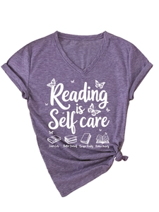 Detail of V-neck heather purple T-shirt with Reading is Self care butterfly print