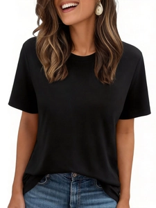 Classic black short-sleeve t-shirt for women paired with stylish blue wash denim jeans