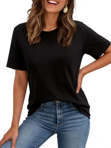 Detailed texture of black short sleeve crew neck T-shirt paired with light blue denim jeans