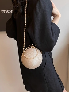 Sparkly champagne gold spherical evening clutch with rhinestone ring handle and chain strap