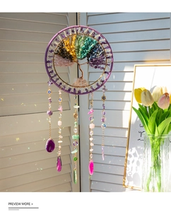Macro detail of Tree of Life suncatcher featuring colorful crystals and agate slices