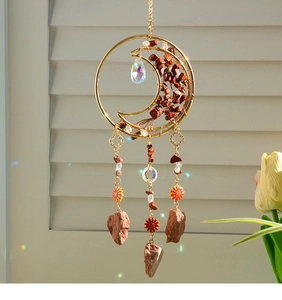 Macro detail of agate moon dreamcatcher with crystal prism reflecting rainbow light