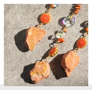 Detail of agate stone and sunflower pendant on tree of life dreamcatcher chime