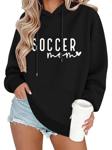 Detail view of Soccer Mom print on black oversized hoodie with white heart graphic