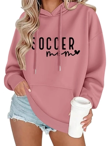 Detail view of SOCCER MOM print and soft fabric texture on mauve oversized hoodie