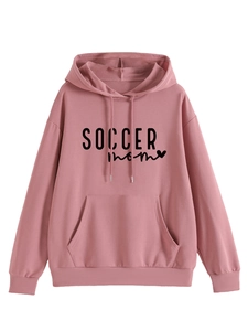 Detailed close-up of SOCCER MOM print and pink hoodie fabric with front pocket