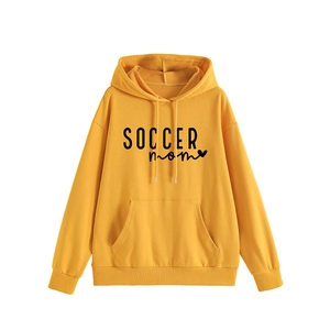 Ginger yellow SOCCER MOM hoodie for women featuring a minimalist heart print and front pocket